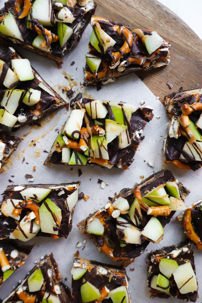 Caramel Apple Date Bark on parchment paper.