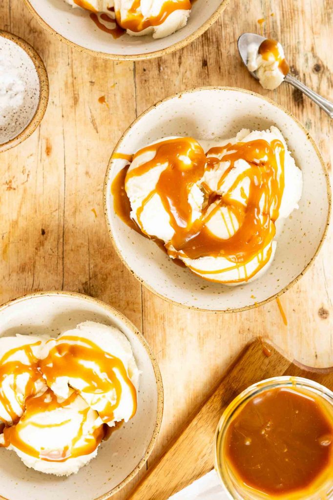 Caramel sauce on vanilla ice cream.