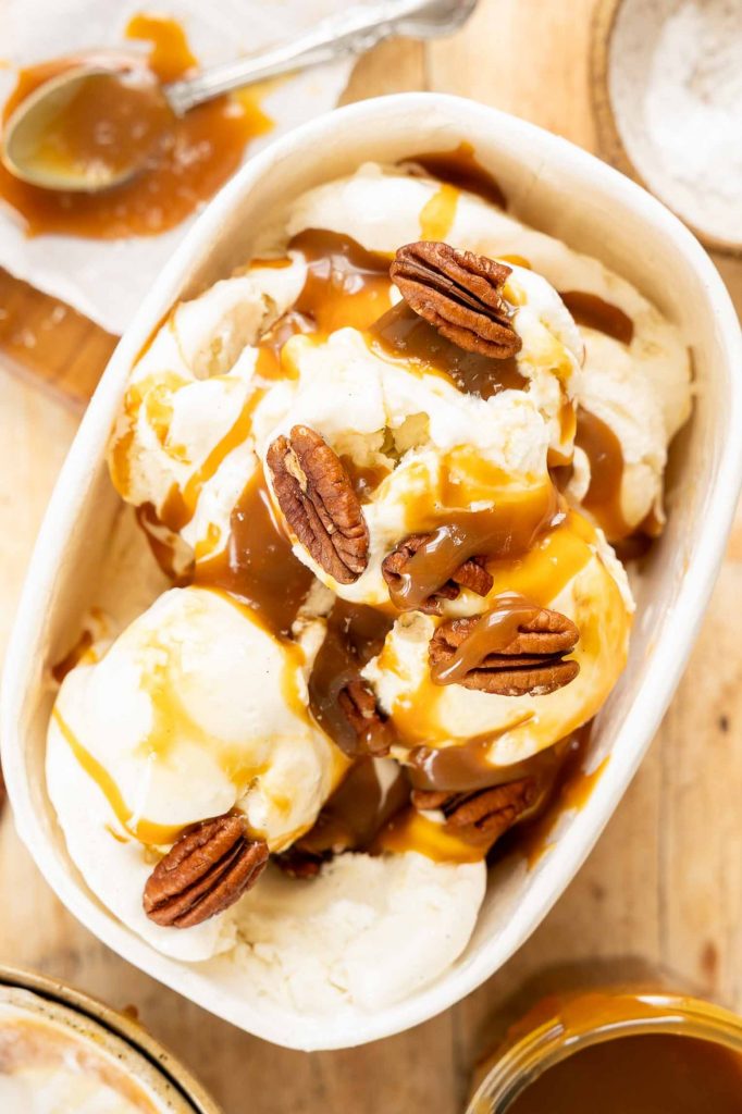 Caramel sauce on vanilla ice cream.