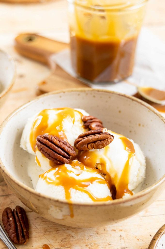 Caramel sauce on vanilla ice cream.