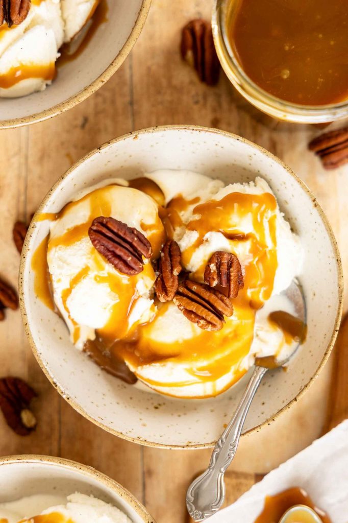 Caramel sauce on vanilla ice cream.