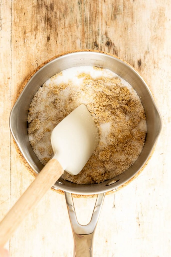 Brown sugar and white sugar in a sauce pan.