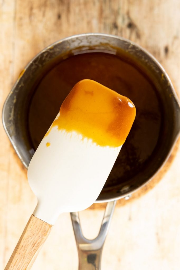 Caramel sauce in a sauce pan.