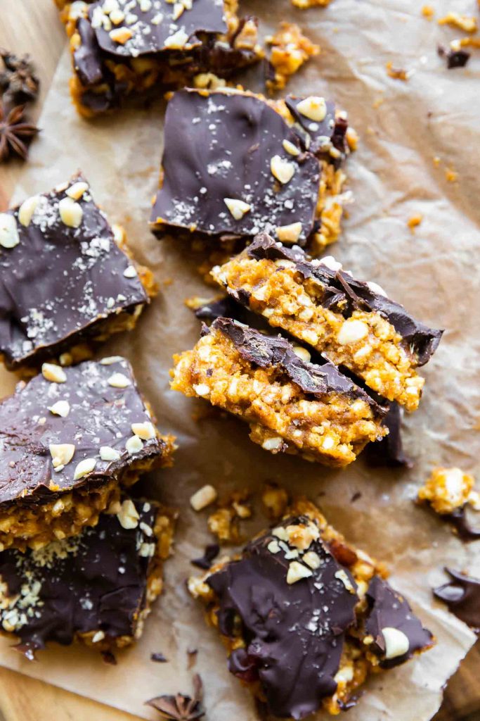 Pumpkin crunch squares on parchment paper.