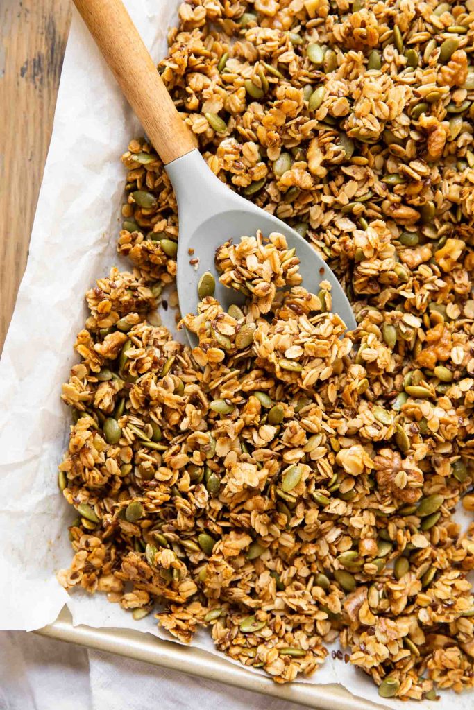 Pumpkin granola on a baking sheet.