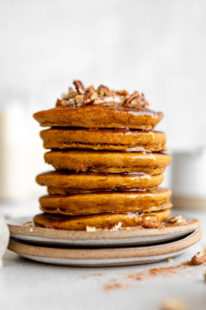 A stack of pumpkin oatmeal pancakes on a plate.