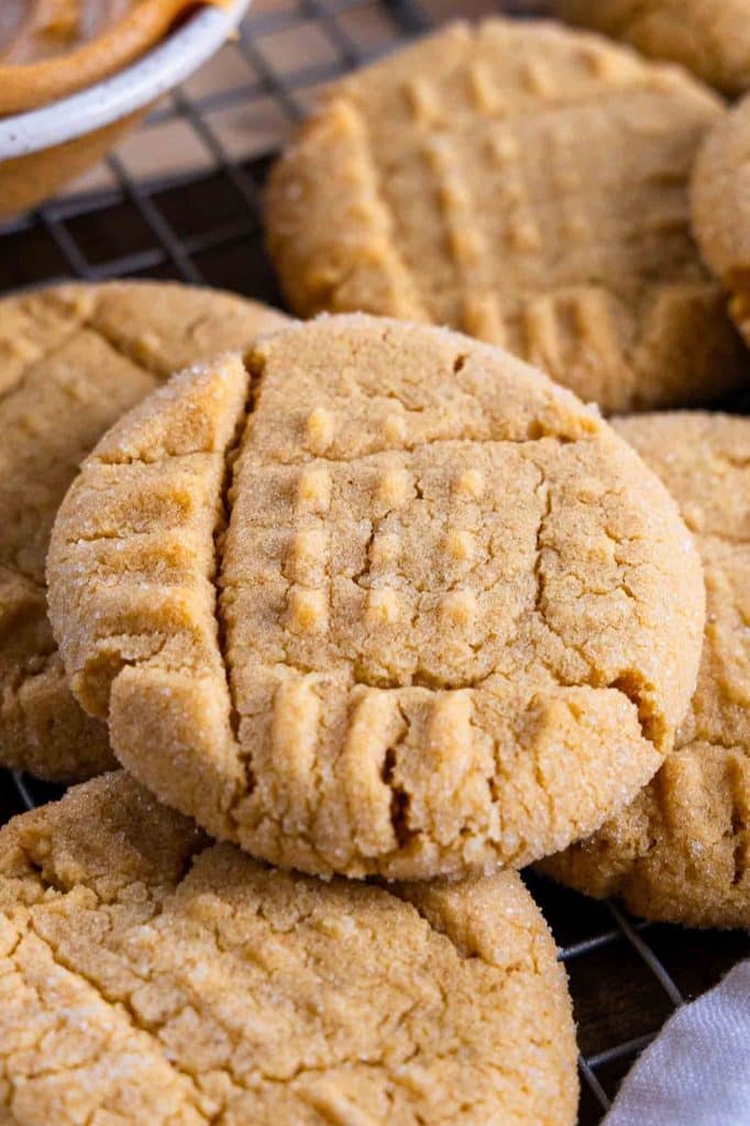Close up image of Peanut Butter Cookies on a cooling rack.
