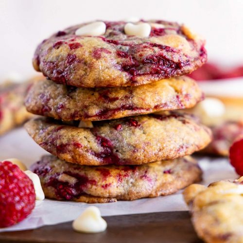 Raspberry cookies stacked on top of each other.