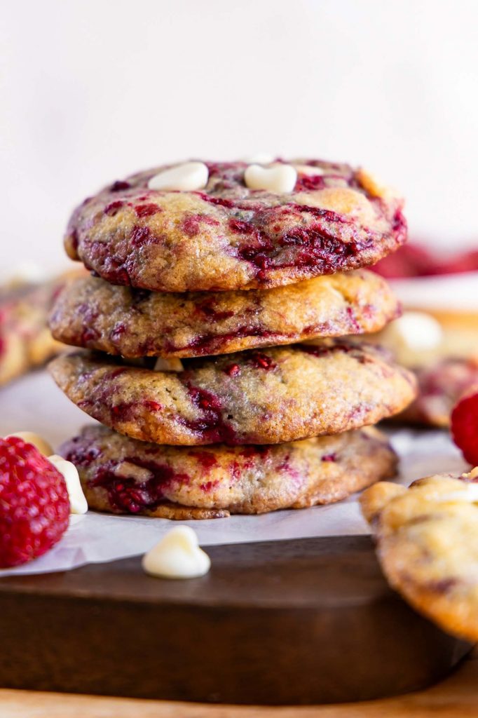 Raspberry cookies stacked on top of each other.