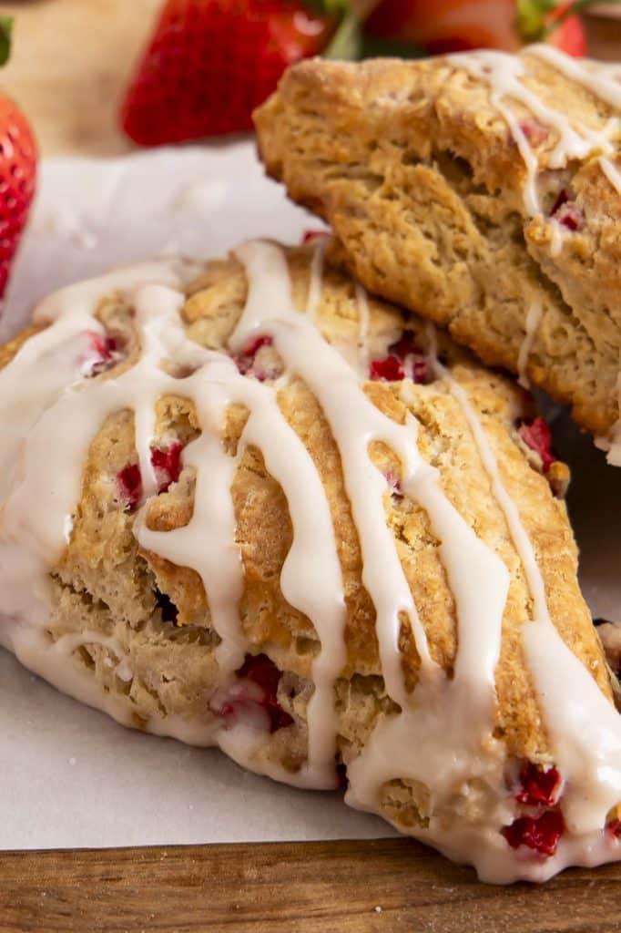 Strawberry scones on parchment paper.