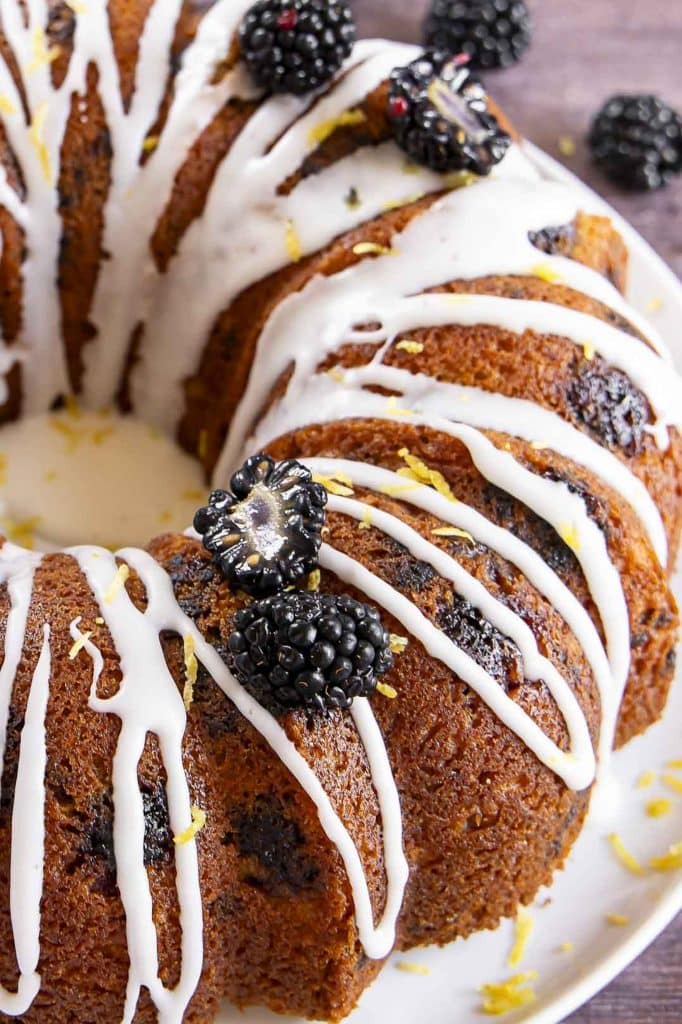 Lemon Blackberry cake on a cake stand.
