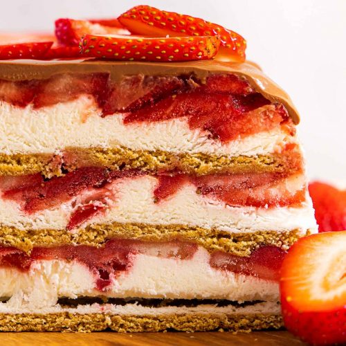 Strawberry Icebox cake on a cutting board.