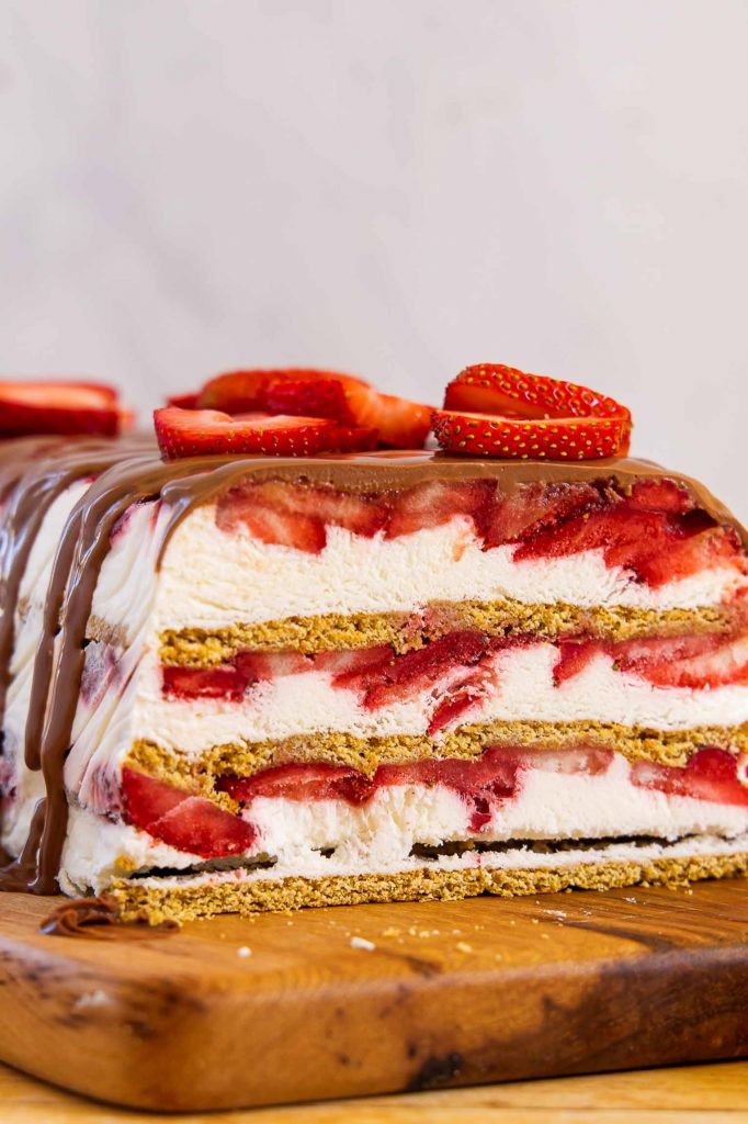 Strawberry Icebox cake on a cutting board.