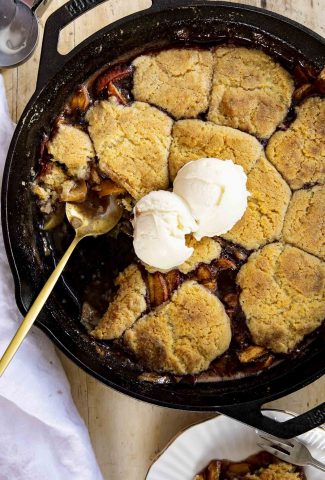 Peach cobbler in a skillet.