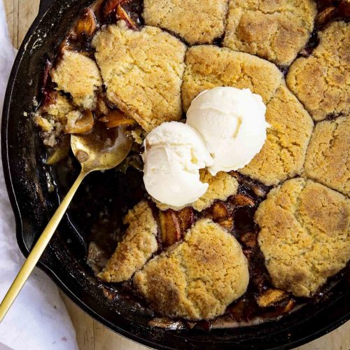 Peach cobbler in a skillet.