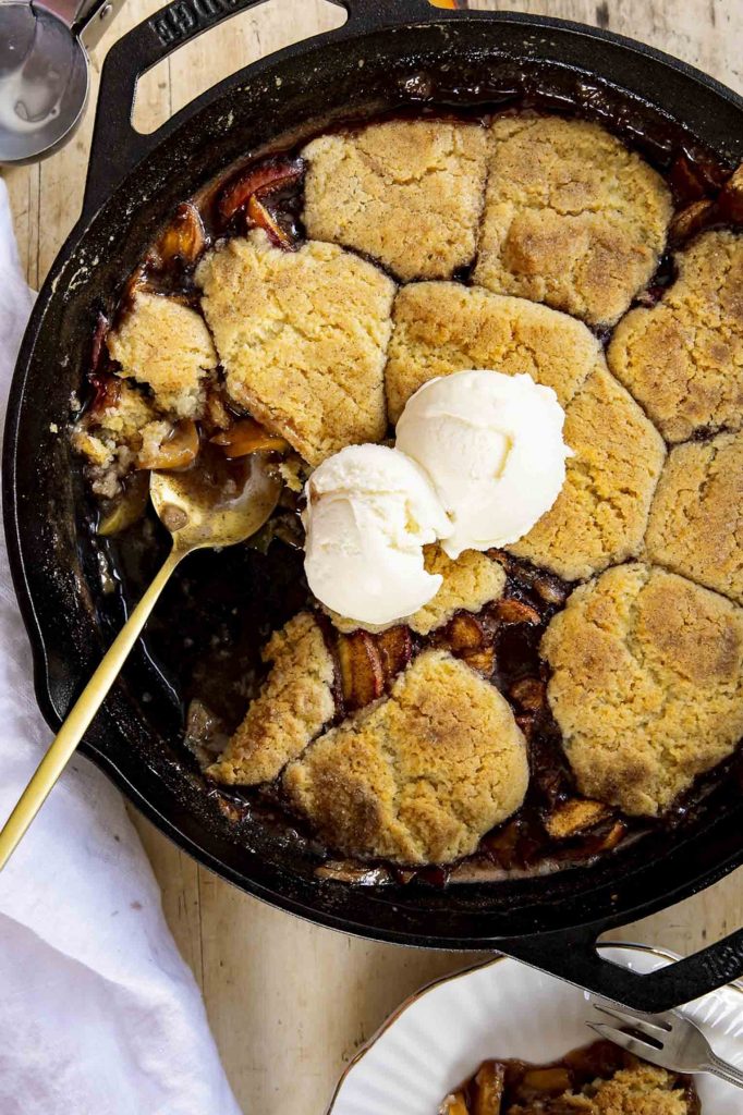 Peach cobbler in a skillet.