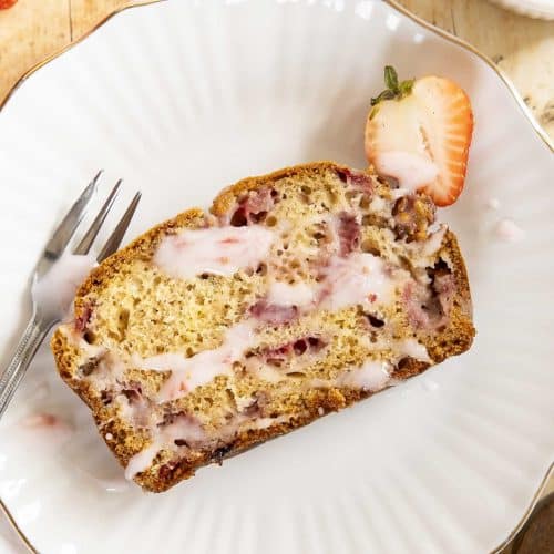 A slice of strawberry bread on a plate.