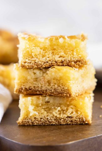 A stack of three gooey butter cake squares.