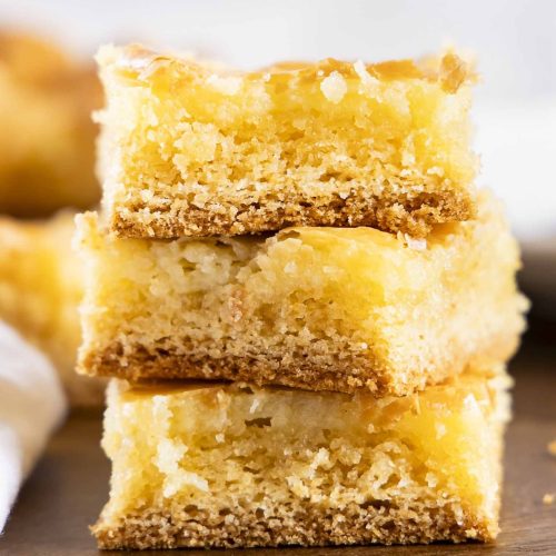 A stack of three gooey butter cake squares.
